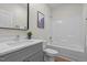 Clean bathroom featuring a single vanity with white countertop and a shower-tub combo at 1368 Ohio Ln, Sanford, NC 27332