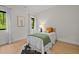 Cozy bedroom with light walls, wood floors, and natural light at 1368 Ohio Ln, Sanford, NC 27332