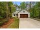 Charming craftsman home with a pristine driveway, a two-car garage, and an idyllic wooded lot at 1368 Ohio Ln, Sanford, NC 27332
