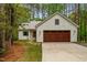 Front exterior of the home with a driveway, garage, and grassy yard at 1368 Ohio Ln, Sanford, NC 27332