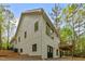 Exterior angle of house featuring light colored siding, black trim, and a deck at 1368 Ohio Ln, Sanford, NC 27332