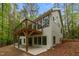 Exterior angle showing an elevated wood deck and a concrete patio beneath it at 1368 Ohio Ln, Sanford, NC 27332