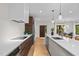 Contemporary kitchen featuring a large island with seating, stainless steel appliances, and minimalist design at 1368 Ohio Ln, Sanford, NC 27332