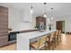 Modern kitchen with spacious island, sleek countertops, pendant lighting, and stainless steel appliances at 1368 Ohio Ln, Sanford, NC 27332
