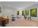 Bright and airy living room with a leather couch, rug, and large windows at 1368 Ohio Ln, Sanford, NC 27332