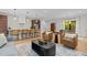 Bright living room featuring modern furnishings, stylish decor, and seamless flow to kitchen and dining area at 1368 Ohio Ln, Sanford, NC 27332
