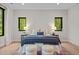 Cozy main bedroom featuring large windows, comfortable bedding, side tables, and contemporary lamps at 1368 Ohio Ln, Sanford, NC 27332