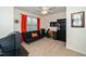 Bedroom/office with a futon, desk, bookshelf, and orange accents at 140 Torrey Heights Ln, Durham, NC 27703