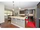 Modern kitchen featuring granite countertops, stainless steel appliances, and center island at 140 Torrey Heights Ln, Durham, NC 27703