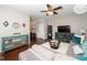 Inviting living room featuring a plush sofa, glass coffee table, and stylish decor at 140 Torrey Heights Ln, Durham, NC 27703