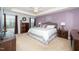 Serene main bedroom with a tray ceiling, king-sized bed, and decorative wall art at 140 Torrey Heights Ln, Durham, NC 27703