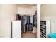 Organized walk-in closet with clothing racks, shelving, and shoe storage, maximizing space at 140 Torrey Heights Ln, Durham, NC 27703