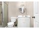 Bathroom featuring a white vanity, oval mirror, and a glass-enclosed shower at 1454 Spring Pond Rd, Nashville, NC 27856
