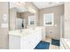 Bathroom boasting double vanity, tile flooring, and separate shower and bathtub at 1454 Spring Pond Rd, Nashville, NC 27856