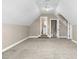 A cozy bedroom features neutral carpet, steps up to the bathroom, and two entrance doors at 1454 Spring Pond Rd, Nashville, NC 27856