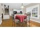 Open concept breakfast area leading to kitchen and staircase with natural light at 1454 Spring Pond Rd, Nashville, NC 27856