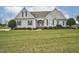 Beautiful house with an expansive green lawn and well-maintained landscaping at 1454 Spring Pond Rd, Nashville, NC 27856