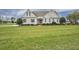 Inviting home with a lush green lawn and manicured landscaping at 1454 Spring Pond Rd, Nashville, NC 27856