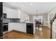 Bright kitchen featuring white cabinetry, granite countertops, stainless steel appliances and tile backsplash at 1454 Spring Pond Rd, Nashville, NC 27856