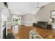 Inviting living room with hardwood floors, a fireplace, and a front door view at 1454 Spring Pond Rd, Nashville, NC 27856
