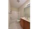A bathroom featuring a single vanity and a shower and tub combination, with tile floors at 1521 Providence Glen Dr # 1521, Chapel Hill, NC 27514
