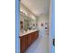 Bright bathroom features a double sink vanity with wood cabinets and a large mirror, and a glass enclosed shower at 1521 Providence Glen Dr # 1521, Chapel Hill, NC 27514