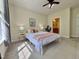 Comfortable bedroom with neutral walls, stylish bed, and natural light pouring in from a window at 1521 Providence Glen Dr # 1521, Chapel Hill, NC 27514