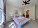 Bright, inviting bedroom features a stylish white bed, modern decor, and lots of natural light at 1521 Providence Glen Dr # 1521, Chapel Hill, NC 27514