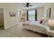 Inviting bedroom with a comfortable bed, stylish desk setup, and natural light from the window at 1521 Providence Glen Dr # 1521, Chapel Hill, NC 27514