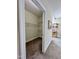 Walk-in closet with carpet and multiple wire shelving units provides lots of storage space at 1521 Providence Glen Dr # 1521, Chapel Hill, NC 27514