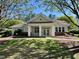 Beautiful clubhouse with welcoming entrance framed by mature trees and landscaping at 1521 Providence Glen Dr # 1521, Chapel Hill, NC 27514