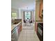 Dining area features a round table with four chairs, chandelier, and natural lighting at 1521 Providence Glen Dr # 1521, Chapel Hill, NC 27514