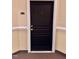 Stylish black apartment door with gold hardware and unit number, enhancing entryway appeal at 1521 Providence Glen Dr # 1521, Chapel Hill, NC 27514
