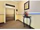 Hallway view featuring a clean elevator entrance and a decorative flower arrangement on a table at 1521 Providence Glen Dr # 1521, Chapel Hill, NC 27514