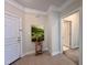 Welcoming entryway featuring tile flooring, neutral walls, and stylish decor with access to another room at 1521 Providence Glen Dr # 1521, Chapel Hill, NC 27514