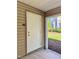 Condo exterior featuring a door with K-3 on it, and a peek at a bright lawn and foliage at 1521 Providence Glen Dr # 1521, Chapel Hill, NC 27514