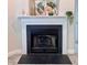 Close-up of a fireplace with decorative accents, enhancing the cozy ambiance of the living space at 1521 Providence Glen Dr # 1521, Chapel Hill, NC 27514