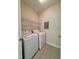 Laundry room with washer, dryer, wire shelving for storage, and a neutral color scheme at 1521 Providence Glen Dr # 1521, Chapel Hill, NC 27514