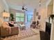 Inviting living room with comfortable seating, fireplace, and a view into the dining area at 1521 Providence Glen Dr # 1521, Chapel Hill, NC 27514