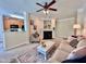 Spacious living room with cozy seating, fireplace, and seamless transition to an open kitchen at 1521 Providence Glen Dr # 1521, Chapel Hill, NC 27514