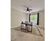Bright room features a desk and chair set on a patterned rug beneath a ceiling fan at 1521 Providence Glen Dr # 1521, Chapel Hill, NC 27514
