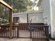 Backyard featuring a deck with lattice accents and exercise equipment, perfect for outdoor workouts at 158 Randolph Dr, Clayton, NC 27520