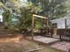 Backyard deck features a charming outdoor area and garden offering a blend of relaxation and natural beauty at 158 Randolph Dr, Clayton, NC 27520