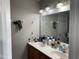 Bathroom featuring a double vanity sink, with neutral paint and generous counter space at 158 Randolph Dr, Clayton, NC 27520