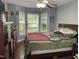 Inviting bedroom with a large window, offering plenty of natural light, and wood-look flooring at 158 Randolph Dr, Clayton, NC 27520