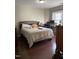 Comfortable bedroom with hardwood floors and a well-lit workspace, perfect for relaxation and productivity at 158 Randolph Dr, Clayton, NC 27520