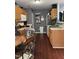 Functional kitchen with wood cabinets, stainless steel sink, and modern appliances at 158 Randolph Dr, Clayton, NC 27520
