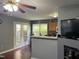 An open-concept kitchen area with French doors and a half-wall bar for easy entertaining at 158 Randolph Dr, Clayton, NC 27520