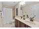 Bathroom with double sink vanity, stylish fixtures, and a shower/tub combo, maximizing space and functionality at 1602 Eagle Lodge Ln, Durham, NC 27703