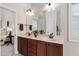 Spacious bathroom featuring double sink vanity, and a large mirror, providing ample space and light at 1602 Eagle Lodge Ln, Durham, NC 27703